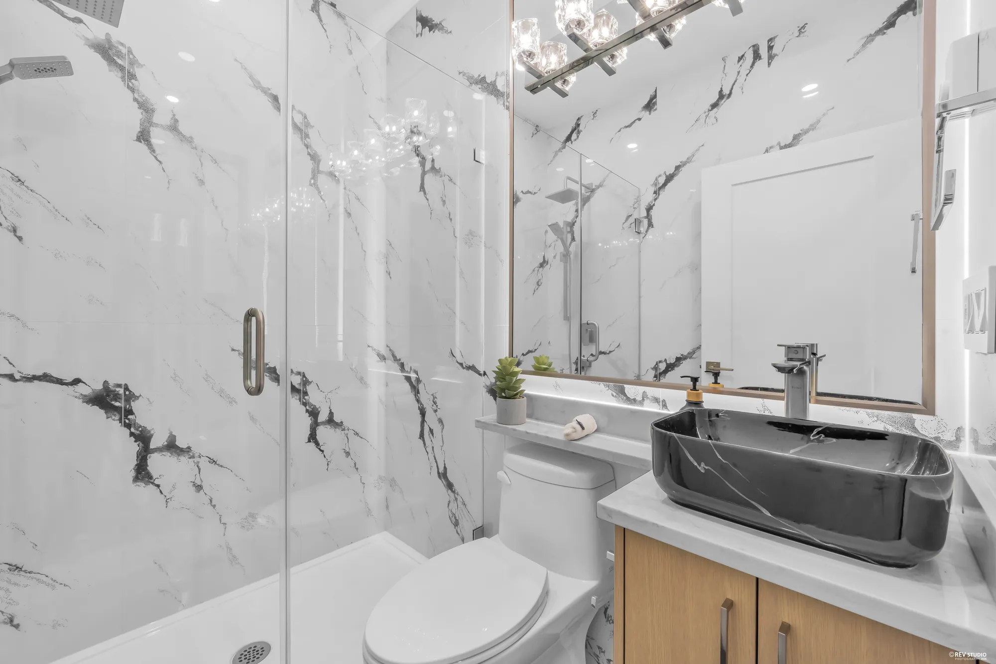 Bathroom with a marble-look shower surround