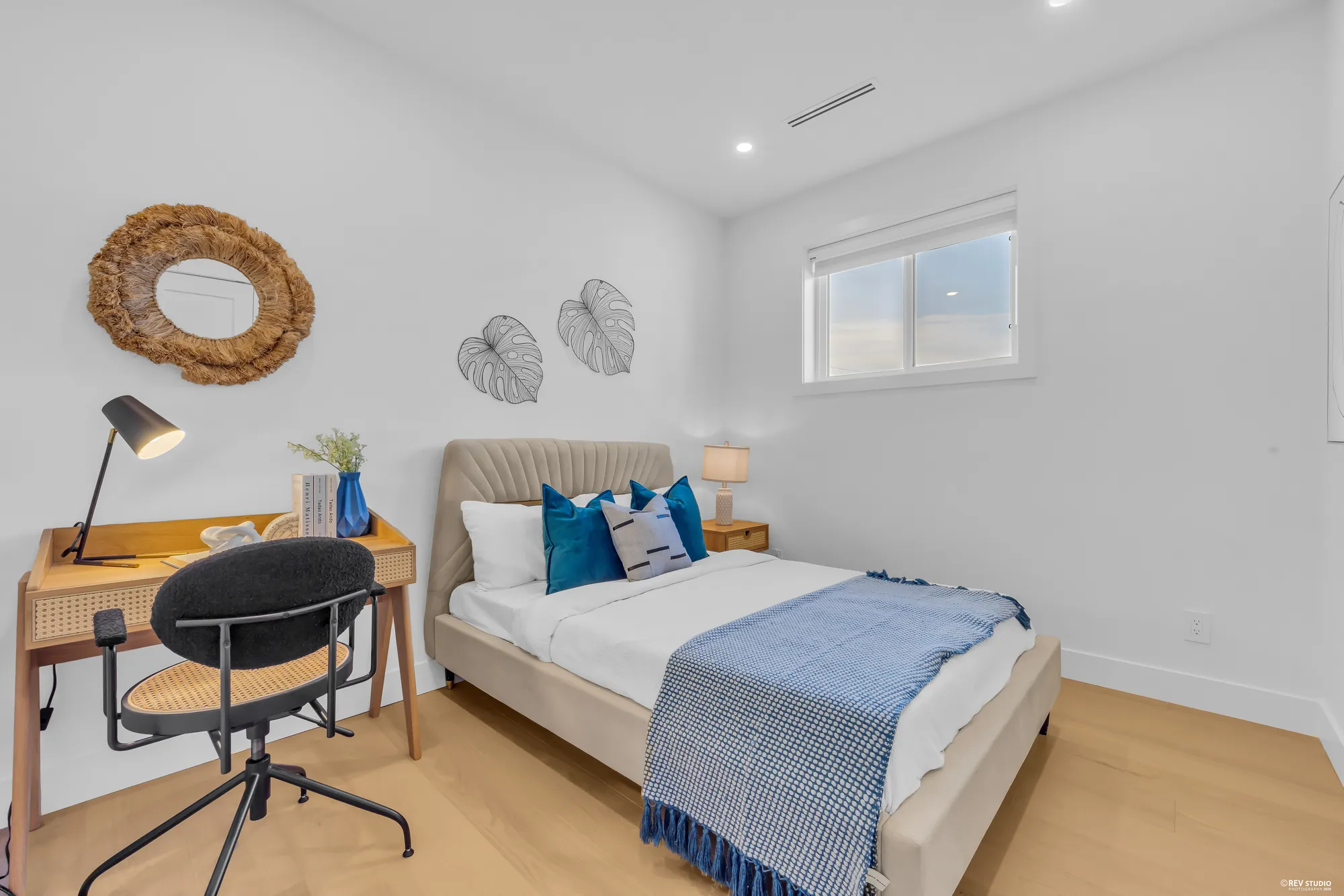 Second bedroom with a desk under the window