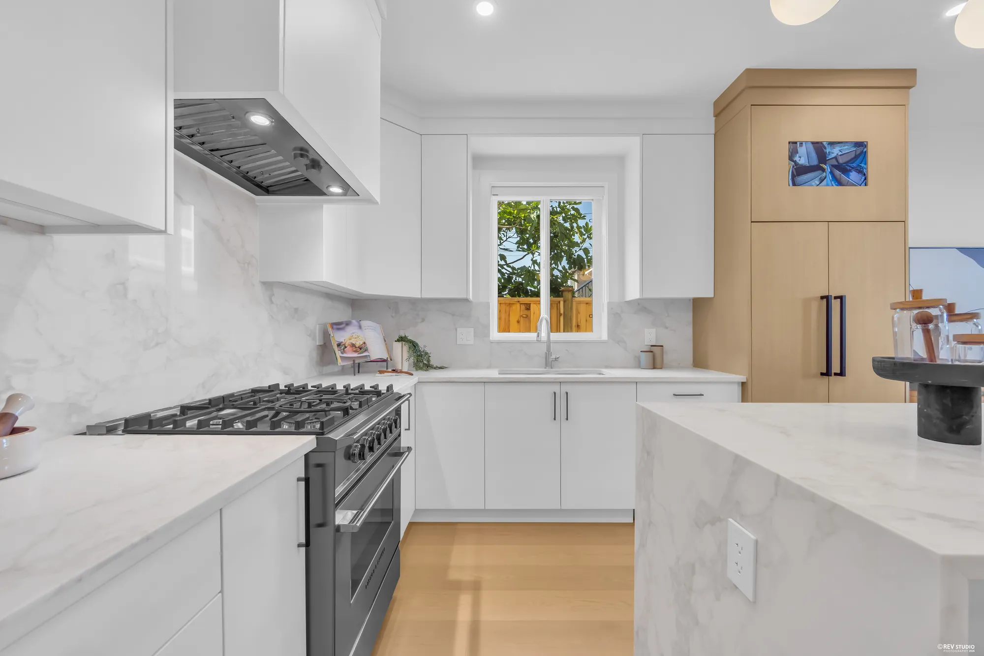 Kitchen with the hood and window over the sink
