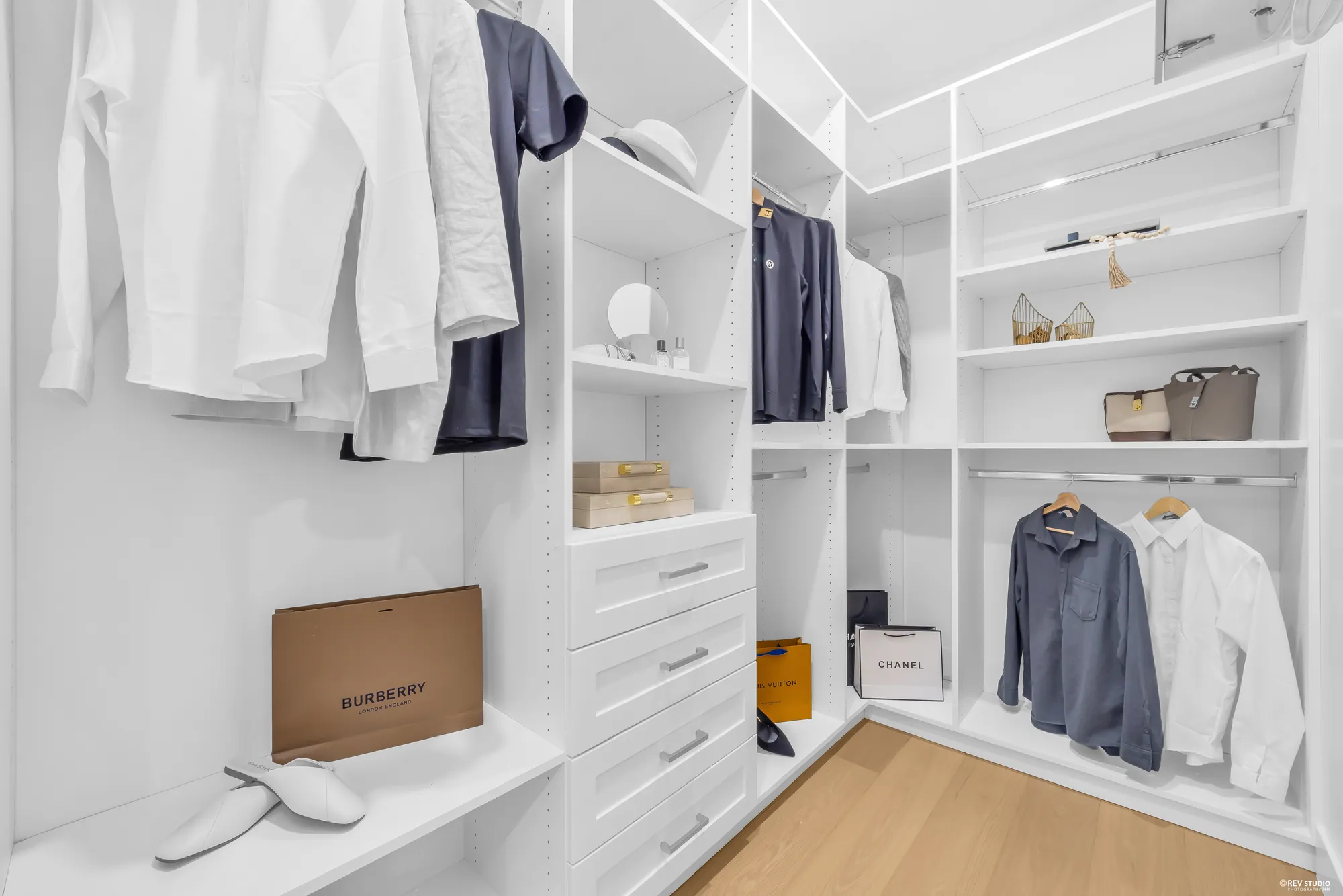 Walk-in closet with built-in shelving and hanging